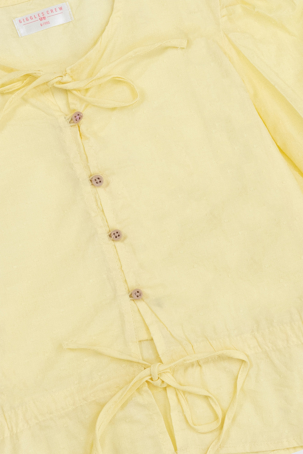 yellow puff-sleeve tie-neck shirt
